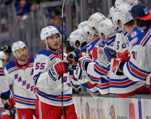 Jan 8, 2022; Anaheim, California, USA; New York Rangers defenseman Ryan Lindgren (55) is congratulated at the bench after scoring an empty net goal in the third period against the Anaheim Ducks at Honda Center. Mandatory Credit: Jayne Kamin-Oncea-USA TODAY Sports