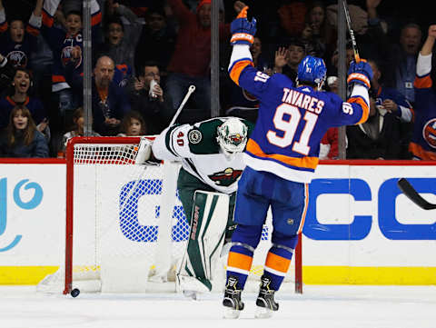 NEW YORK, NY – FEBRUARY 19: John Tavares #91 of the New York Islanders celebrates a second-period goal by teammate Anders Lee #27 (not pictured) against Devan Dubnyk #40 of the Minnesota Wild at Barclays Center on February 19, 2018 in the Brooklyn borough of New York City. (Photo by Paul Bereswill/NHLI via Getty Images)