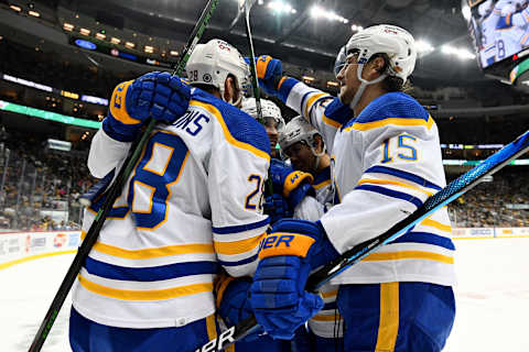 PITTSBURGH, PENNSYLVANIA – DECEMBER 17: Zemgus Girgensons #28 of the Buffalo Sabres celebrates his goal with teammates during the second period of a game against the Pittsburgh Penguins at PPG PAINTS Arena on December 17, 2021 in Pittsburgh, Pennsylvania. (Photo by Emilee Chinn/Getty Images)