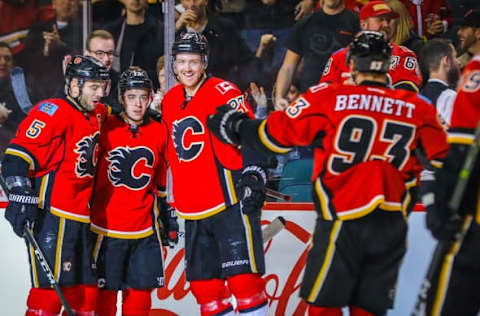 Dec 4, 2016; Calgary, Alberta, CAN; Calgary Flames left wing Johnny Gaudreau (13) celebrates his goal with teammates against the Anaheim Ducks during the first period at Scotiabank Saddledome. Mandatory Credit: Sergei Belski-USA TODAY Sports