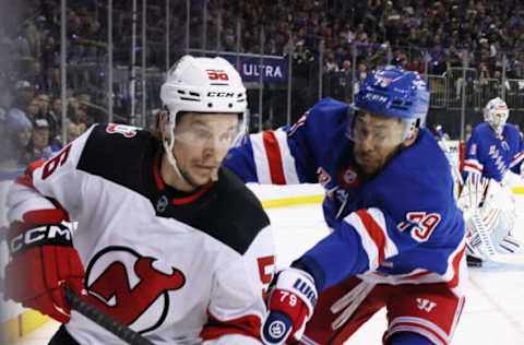 NEW YORK, NEW YORK – APRIL 29: K’Andre Miller #79 of the New York Rangers checks Erik Haula #56 of the New Jersey Devils in Game Six of the First Round of the 2023 Stanley Cup Playoffs at Madison Square Garden on April 29, 2023, in New York, New York. The Rangers defeated the Devils 5-2. (Photo by Bruce Bennett/Getty Images)