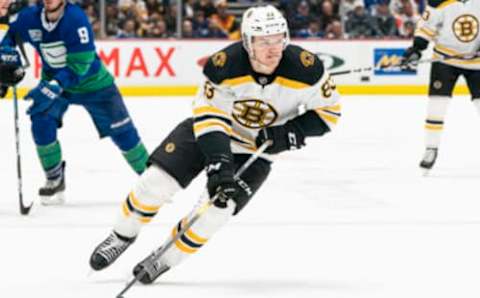 VANCOUVER, BC – FEBRUARY 22: Karson Kuhlman #83 of the Boston Bruins skates with the puck during NHL action against the Vancouver Canucks at Rogers Arena on February 22, 2020 in Vancouver, Canada. (Photo by Rich Lam/Getty Images)