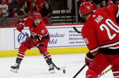 RALEIGH, NC – APRIL 4: Teuvo Teravainen #86 of the Carolina Hurricanes passes the puck to teammate Sebastian Aho #20 against the New Jersey Devils during an NHL game at PNC Arena on April 4, 2019, in Raleigh, North Carolina. (Photo by Gregg Forwerck/NHLI via Getty Images)