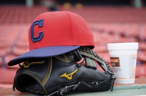 Aug 18, 2015; Boston, MA, USA; The glove and hat of Cleveland Indians starting pitcher Corey Kluber (28) rest on the third base wall prior to a game against the Boston Red Sox at Fenway Park. Mandatory Credit: Bob DeChiara-USA TODAY Sports