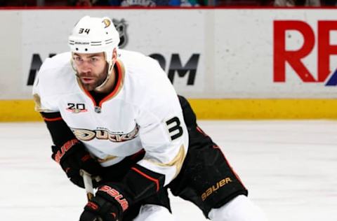 VANCOUVER, BC – April 7: Daniel Winnik #34 of the Anaheim Ducks skates up ice with the puck during their NHL game against the Vancouver Canucks at Rogers Arena April 7, 2014, in Vancouver, British Columbia, Canada. Anaheim won 3-0 to eliminate the Canucks from the playoffs. (Photo by Jeff Vinnick/NHLI via Getty Images)