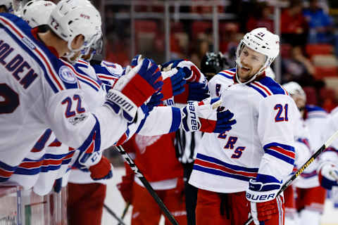 Mar 12, 2017; Detroit, MI, USA; New York Rangers center Derek Stepan (21) receives congratulations from teammates after scoring in the third period against the Detroit Red Wings at Joe Louis Arena. New York won 4-1. Mandatory Credit: Rick Osentoski-USA TODAY Sports