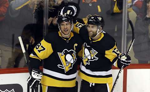 Pittsburgh Penguins left wing Jason Zucker (16) reacts with center Sidney Crosby (87). Mandatory Credit: Charles LeClaire-USA TODAY Sports