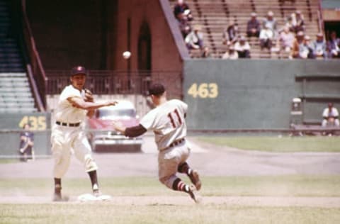 CLEVELAND, OH – MAY 26: Bobby Avila #1 of the Cleveland Indians steps on the bag and throws to first to complete a double play as Clint Courtney #11 of the Chicago White Sox tries to break up the play during their MLB game on May 26, 1955 at Cleveland Municipal Stadium in Cleveland, Ohio. (Photo by Hy Peskin/Getty Images) (SetNumber: X2689)