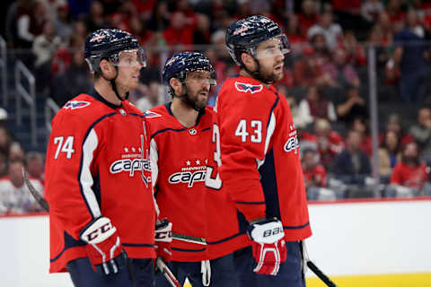 WASHINGTON, DC – OCTOBER 08: John Carlson #74, Alex Ovechkin #8, and Tom Wilson #43 of the Washington Capitals look on against the Dallas Stars at Capital One Arena on October 08, 2019 in Washington, DC. (Photo by Rob Carr/Getty Images)