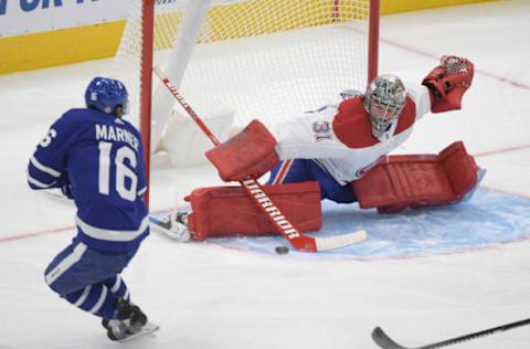 Jan 13, 2021; Toronto, Ontario, CAN; Montreal Canadiens goaltender Carey Price (31) makes a save against Toronto Maple Leafs center Mitch Marner (16) during the second period at Scotiabank Arena. Mandatory Credit: Dan Hamilton-USA TODAY Sports