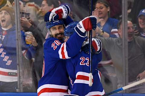 Jan 24, 2022; New York, New York, USA; New York Rangers left wing Chris Kreider (20) celebrates with New York Rangers defenseman Adam Fox (23) after scoring a power play goal against the Los Angeles Kings during the first period at Madison Square Garden. Mandatory Credit: Dennis Schneidler-USA TODAY Sports