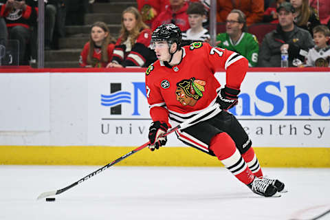 CHICAGO, ILLINOIS – MARCH 20: Kirby Dach #77 of the Chicago Blackhawks skates against the Winnipeg Jets on March 20, 2022 at the United Center in Chicago, Illinois. (Photo by Jamie Sabau/Getty Images)