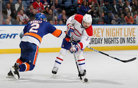 UNIONDALE, NY – FEBRUARY 09: Mark Streit against Tomas Plekanec #14 of the Montreal Canadiens (Photo by Jim McIsaac/Getty Images)