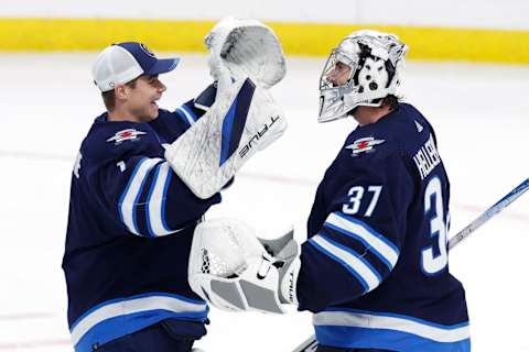 Winnipeg Jets, Eric Comrie (1), Connor Hellebuyck (37). Mandatory Credit: James Carey Lauder-USA TODAY Sports