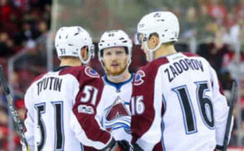 NEWARK, NJ – FEBRUARY 14: Colorado Avalanche left wing Gabriel Landeskog (92) talks with teammates Fedor Tyutin (51) and defenseman Nikita Zadorov (16). (Photo by Rich Graessle/Icon Sportswire via Getty Images)