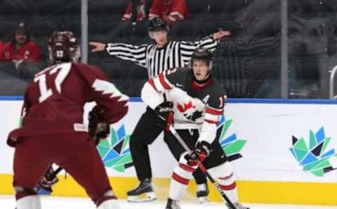 EDMONTON, ALBERTA – AUGUST 10: Kent Johnson #13 of Canada controls the puck against Latvia during the Group A game of the 2022 IIHF World Junior Championship at Rogers Place on August 10, 2022 in Edmonton, Alberta, Canada. (Photo by Lawrence Scott/Getty Images)