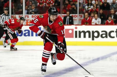 Oct 12, 2016; Chicago, IL, USA; Chicago Blackhawks center Artem Anisimov (15) controls the puck against the St. Louis Blues during the first period at United Center. Mandatory Credit: Kamil Krzaczynski-USA TODAY Sports