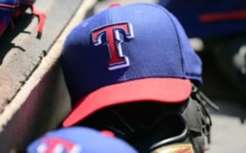 Mar 14, 2015; Peoria, AZ, USA; A Texas Rangers cap sits in the dugout against the San Diego Padres at Peoria Sports Complex. Mandatory Credit: Joe Camporeale-USA TODAY Sports