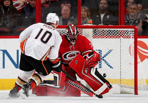 RALEIGH, NC – OCTOBER 29: Corey Perry #10 of the Anaheim Ducks scores the winning goal on Scott Darling #30 in a shootout during an NHL game on October 29, 2017 at PNC Arena in Raleigh, North Carolina. (Photo by Gregg Forwerck/NHLI via Getty Images)