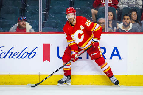 Oct 2, 2023; Calgary, Alberta, CAN; Calgary Flames center Elias Lindholm (28) controls the puck against the Winnipeg Jets during the second period at Scotiabank Saddledome. Mandatory Credit: Sergei Belski-USA TODAY Sports