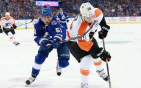 Oct 8, 2015; Tampa, FL, USA; Tampa Bay Lightning center Valtteri Filppula (51) defends Philadelphia Flyers center Claude Giroux (28) during the first period at Amalie Arena. Mandatory Credit: Kim Klement-USA TODAY Sports