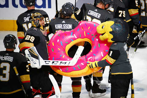 LAS VEGAS, NV – APRIL 16: Marc-Andre Fleury (29) of the Vegas Golden Knights is presented an inflatable doughnut representing his 5-0 shutout by VGK mascot Chance the gila monster (1) after winning Game Four of the Western Conference First Round of the 2019 NHL Stanley Cup Playoffs between the San Jose Sharks and the Vegas Golden Knights on April 16, 2019 at T-Mobile Arena in Las Vegas, Nevada. (Photo by Jeff Speer/Icon Sportswire via Getty Images)