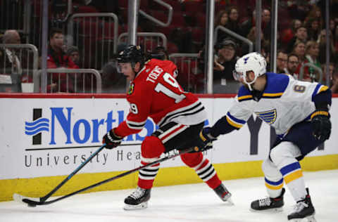 CHICAGO, ILLINOIS – MARCH 08: Jonathan Toews #19 of the Chicago Blackhawks controls the puck as Marco Scandella #6 of the St. Louis Blues closes in at the United Center on March 08, 2020 in Chicago, Illinois. The Blues defeated the Blackhawks 2-0. (Photo by Jonathan Daniel/Getty Images)