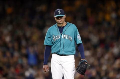 May 27, 2016; Seattle, WA, USA; Seattle Mariners starting pitcher Felix Hernandez (34) walks back to the dugout following the last out of the sixth inning against the Minnesota Twins at Safeco Field. Mandatory Credit: Jennifer Buchanan-USA TODAY Sports