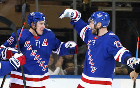 NEW YORK, NEW YORK – JANUARY 02: Ryan Strome #16 of the New York Rangers (L) celebrates his first period goal against the Tampa Bay Lightning and is joined by Barclay Goodrow #21 (R) at Madison Square Garden on January 02, 2022 in New York City. (Photo by Bruce Bennett/Getty Images)