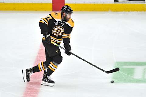 BOSTON, MA – JUNE 12: Boston Bruins defenseman John Moore (27) hard up ice with the puck. During Game 7 of the Stanley Cup Finals featuring the Boston Bruins against the St. Louis Blues on June 12, 2019 at TD Garden in Boston, MA. (Photo by Michael Tureski/Icon Sportswire via Getty Images)