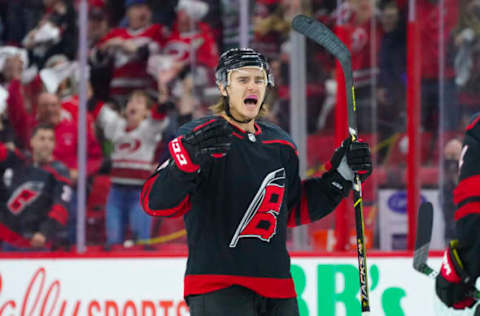 May 30, 2021; Raleigh, North Carolina, USA; Carolina Hurricanes defenseman Jake Bean (24) celebrates his third period goal against the Tampa Bay Lightning in game one of the second round of the 2021 Stanley Cup Playoffs at PNC Arena. Mandatory Credit: James Guillory-USA TODAY Sports