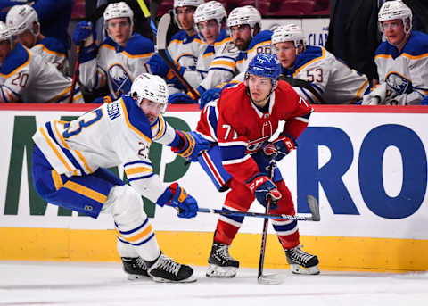 MONTREAL, QC – FEBRUARY 13: Mattias Samuelsson #23 of the Buffalo Sabres and Jake Evans #71 of the Montreal Canadiens skate against each other during the second period at Centre Bell on February 13, 2022 in Montreal, Canada. (Photo by Minas Panagiotakis/Getty Images)