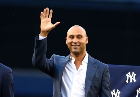 May 24, 2015; Bronx, NY, USA; New York Yankees former player Derek Jeter waves to the crowd during the ceremony retiring Bernie Williams number 51 prior to the game against the Texas Rangers at Yankee Stadium. Mandatory Credit: Andy Marlin-USA TODAY Sports