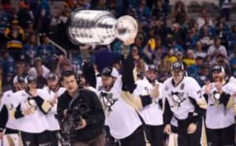 Jun 12, 2016; San Jose, CA, USA; Pittsburgh Penguins center Matt Cullen (7) hoists the Stanley Cup after defeating the San Jose Sharks in game six of the 2016 Stanley Cup Final at SAP Center at San Jose. Mandatory Credit: Gary A. Vasquez-USA TODAY Sports