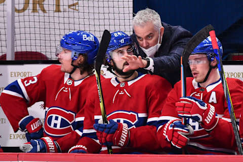 MONTREAL, QC – MARCH 02: Head coach of the Montreal Canadiens Dominique Ducharme speaks with Phillip Danault #24 of the Montreal Canadiens  . (Photo by Minas Panagiotakis/Getty Images)