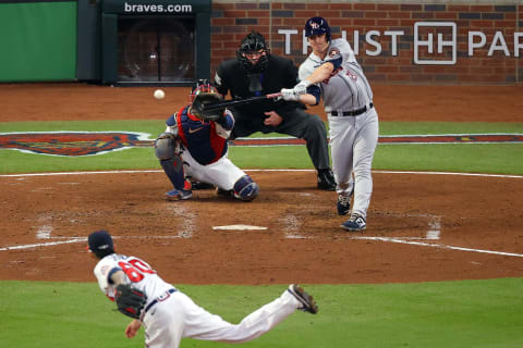 ATLANTA, GEORGIA – OCTOBER 31: Zack Greinke #21 of the Houston Astros gets a pinch-hit single against the Atlanta Braves during the third inning in Game Five of the World Series at Truist Park on October 31, 2021 in Atlanta, Georgia. (Photo by Todd Kirkland/Getty Images)