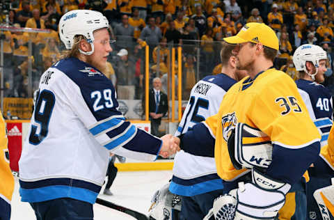 NASHVILLE, TN - MAY 10: Pekka Rinne #35 of the Nashville Predators congratulates Patrik Laine #29 of the Winnipeg Jets after a 5-1 Jets Victory in Game Seven of the Western Conference Second Round during the 2018 NHL Stanley Cup Playoffs at Bridgestone Arena on May 10, 2018 in Nashville, Tennessee. (Photo by Frederick Breedon/Getty Images)