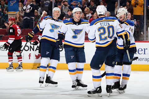 GLENDALE, ARIZONA – DECEMBER 31: Tyler Bozak #21 of the St. Louis Blues celebrates with Alexander Steen #20 and Robert Thomas #18 after scoring a goal against the Arizona Coyotes during the first half of the NHL game at Gila River Arena on December 31, 2019 in Glendale, Arizona. (Photo by Christian Petersen/Getty Images)