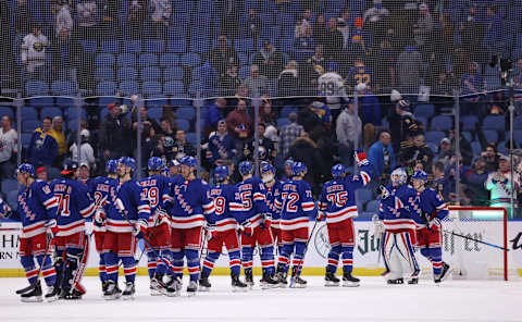 Dec 10, 2021; Buffalo, New York, USA; The New York Rangers celebrate a win over the Buffalo Sabres at KeyBank Center. Mandatory Credit: Timothy T. Ludwig-USA TODAY Sports