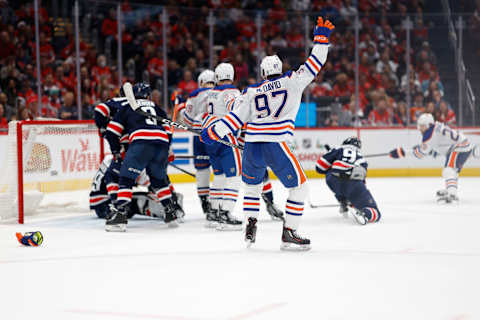 Nov 24, 2023; Washington, District of Columbia, USA; Edmonton Oilers center Connor McDavid (97) celebrates after a goal by Oilers center Leon Draisaitl (29) on Washington Capitals goaltender Charlie Lindgren (79) in the second period at Capital One Arena. Mandatory Credit: Geoff Burke-USA TODAY Sports