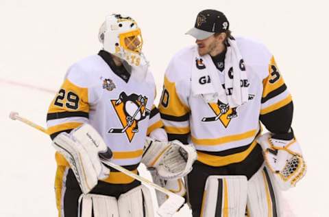 Dec 27, 2016; Newark, NJ, USA; Pittsburgh Penguins goalie Marc-Andre Fleury (29) and goalie Matt Murray (30) celebrate their 5-2 win over the New Jersey Devils at Prudential Center. Mandatory Credit: Ed Mulholland-USA TODAY Sports