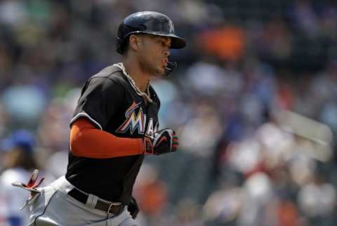 Jul 6, 2016; New York City, NY, USA; Miami Marlins right fielder Giancarlo Stanton (27) rounds the bases after hitting a solo home run against the New York Mets during the sixth inning at Citi Field. Mandatory Credit: Adam Hunger-USA TODAY Sports