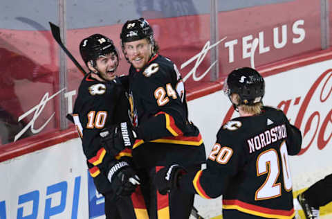 Brett Richie #24, Calgary Flames Mar 4, 2021; Calgary, Alberta, CAN; Calgary Flames forward Brett Richie (24) celebrates his first period goal with forward Derek Ryan (10) against the Ottawa Senators at Scotiabank Saddledome. Mandatory Credit: Candice Ward-USA TODAY Sports