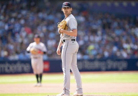 Aug 14, 2022; Toronto, Ontario, CAN; Cleveland Guardians starting pitcher Shane Bieber (57) looks over at first base against the Toronto Blue Jays during the seventh inning at Rogers Centre. Mandatory Credit: Nick Turchiaro-USA TODAY Sports