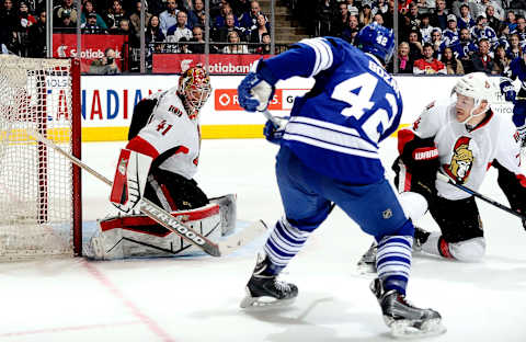 TORONTO , ON – MARCH 28: Tyler Bozak #42 of the Toronto Maple Leafs scores on Craig Anderson #41 of the Ottawa Senators during game action on March 28, 2015 at Air Canada Centre in Toronto, Ontario, Canada. (Photo by Graig Abel/NHLI via Getty Images)