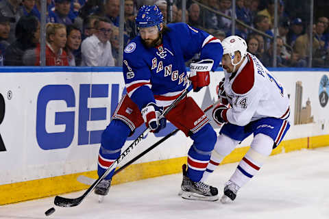 Apr 16, 2017; New York, NY, USA; New York Rangers defenseman Kevin Klein (8) controls the puck in front of Montreal Canadiens center Tomas Plekanec (14) during the first period in game three of the first round of the 2017 Stanley Cup Playoffs at Madison Square Garden. Mandatory Credit: Adam Hunger-USA TODAY Sports