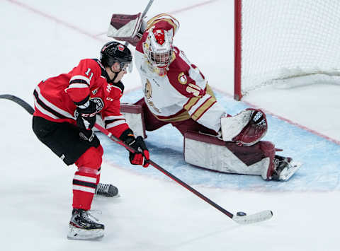 QUEBEC CITY, QC – OCTOBER 27: James Malatesta of the Quebec Remparts takes a shot on Jan Bednar #31 of the Acadie-Bathurst Titan during their QMJHL hockey game at the Videotron Center on October 27, 2021 in Quebec City, Quebec, Canada. (Photo by Mathieu Belanger/Getty Images)