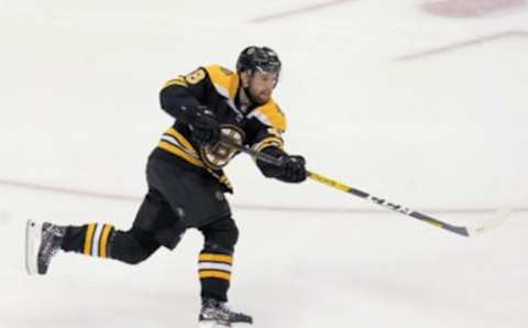 Aug 29, 2020; Toronto, Ontario, CAN; Boston Bruins defenseman Matt Grzelcyk (48) shoots the puck against the Tampa Bay Lightning in game four of the second round of the 2020 Stanley Cup Playoffs at Scotiabank Arena. Mandatory Credit: John E. Sokolowski-USA TODAY Sports