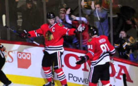 Apr 3, 2016; Chicago, IL, USA; Chicago Blackhawks center Jonathan Toews (19) celebrates his goal with right wing Marian Hossa (81) against the Boston Bruins during the second period at the United Center. Mandatory Credit: David Banks-USA TODAY Sports