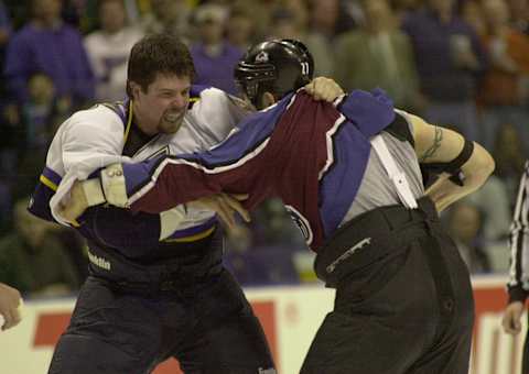 8 Mar 2001: Reed Low #34 of the St. Louis Blues and Scott Parker #27 of the Colorado Avalanche square off during the first period at the Savvis Center in St. Louis, Missouri. DIGITAL IMAGE. Mandatory Credit: Elsa/ALLSPORT